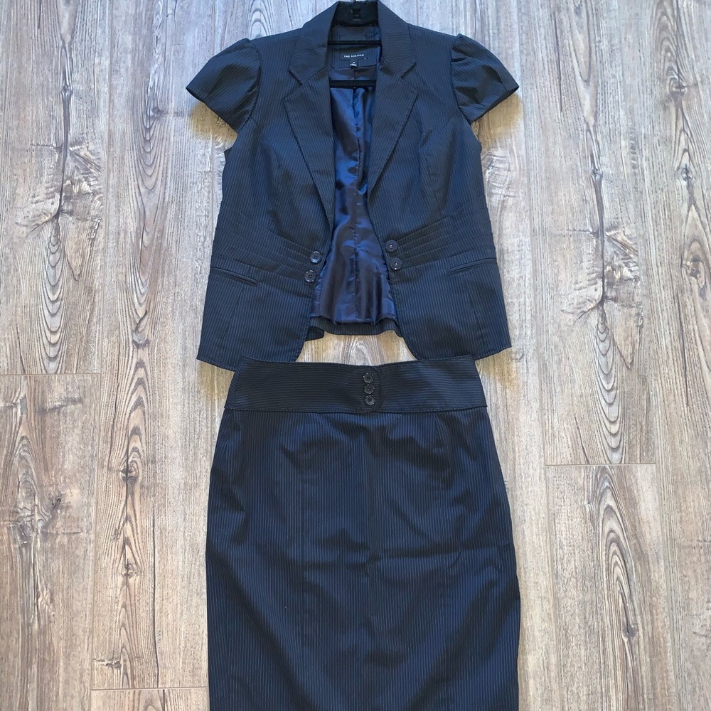 Women’s navy pinstripe skirt suit.